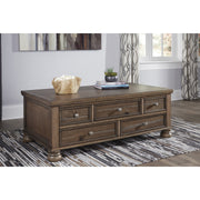 Flynnter Medium Brown Cocktail Table with Storage - bellafurnituretv